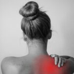 Woman with back and shoulder pain